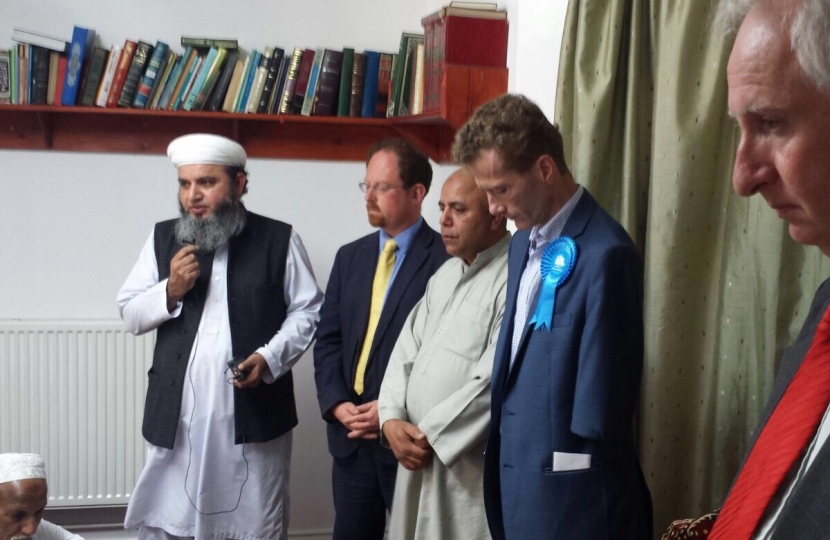 Observing a minute's silence at Cambridge mosque