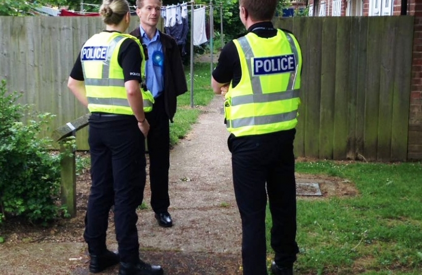John talking with police officers