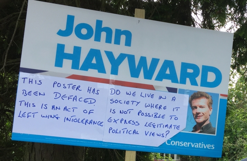 Defaced campaign poster