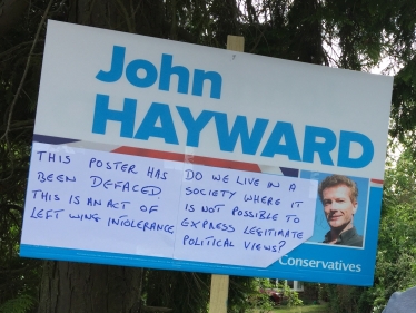 Defaced campaign poster